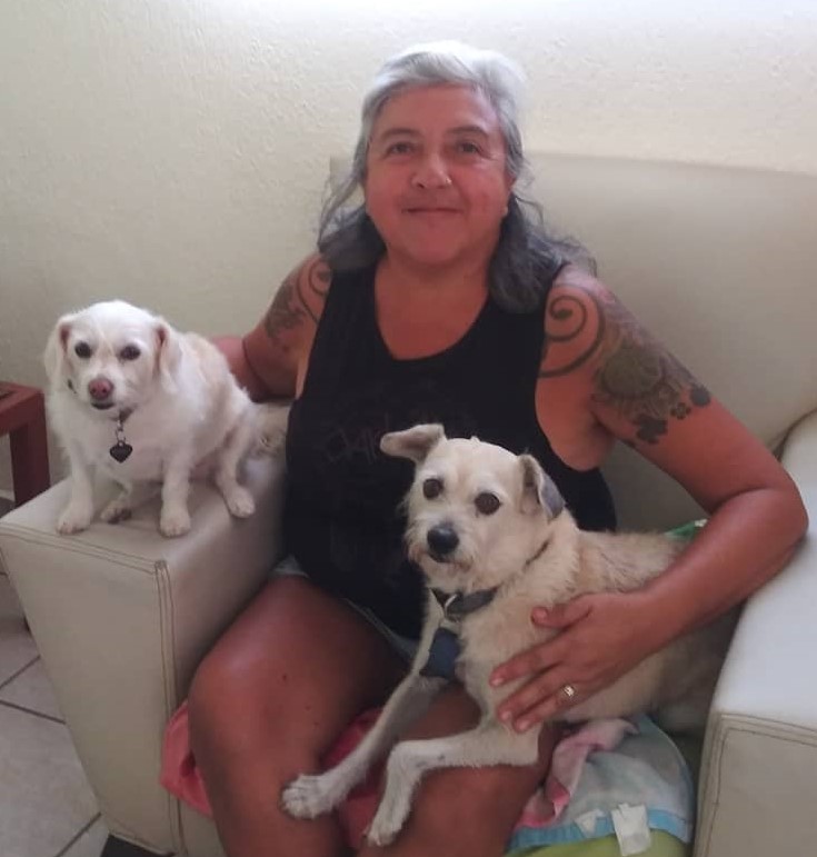 woman on couch with dogs