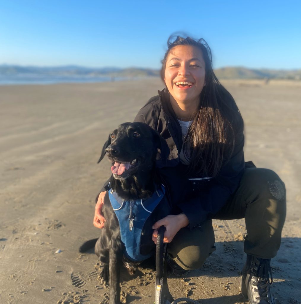 woman on beach with dog